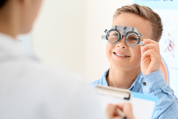 Little boy undergoing eye test in clinic