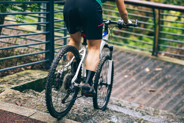 Naklejka premium Woman freerider riding down stairs. Sports extreme and active lifestyle