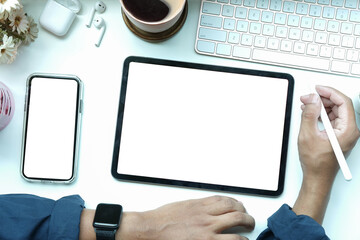 Above view businessman working with digital tablet on white table.
