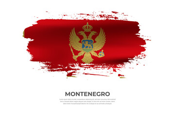 Artistic folded brush flag of Montenegro. Paint smears brush stroke flag on isolated white background