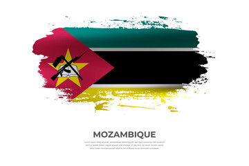 Artistic folded brush flag of Mozambique. Paint smears brush stroke flag on isolated white background