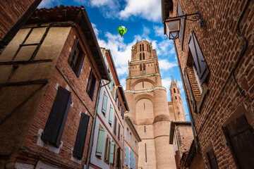 Hot air balloon flies over Albi cathedral in southern France
