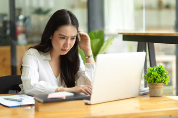 Pensive serious businesswoman, solving problem