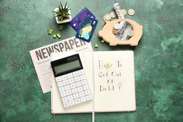 Notebook, calculator and money on color background