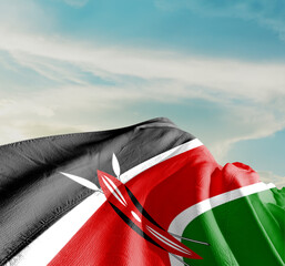 Kenya national flag waving in beautiful clouds.