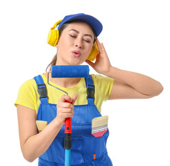 Female painter listening to music in headphones with roller brush on white background