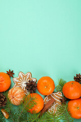 Christmas concept with mandarins on mint background