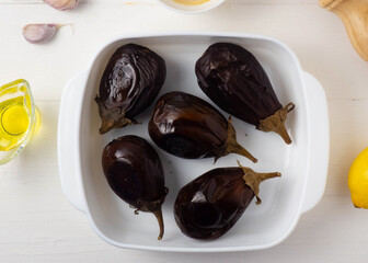 Middle Eastern cuisine-babaganush eggplant caviar from baked eggplant, garlic, tahini, lemon, olive oil, mint. Step-by-step recipe.