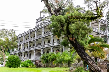 Poster La Domus (Capuchin House), colonial style residential building of cathedral priests (presbytery), former house the Swiss missionaries, architectural gem of Victoria, Mahe Island, Seychelles. © Cleop6atra