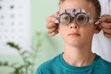 Little boy undergoing eye test in clinic