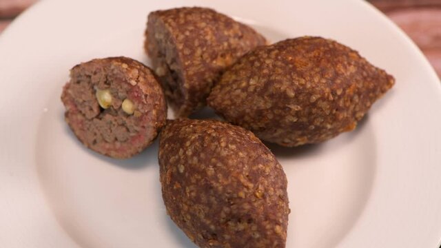 Traditional kebbe on turntable in lebanese restaurant, High quality 4k footage