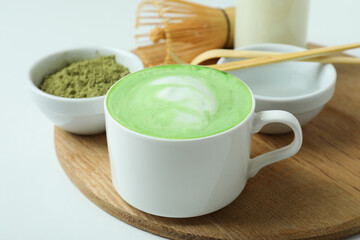 Matcha latte and accessories for making on white background