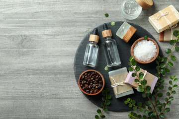 Natural spa cosmetics on gray textured table