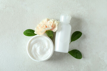 Natural spa cosmetics on white textured table