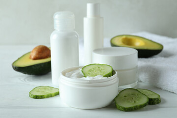 Natural spa cosmetics on white wooden table