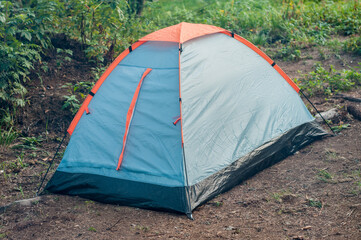small tent standing in the forest