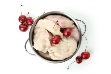 Pot with pierogi with cherry isolated on white background