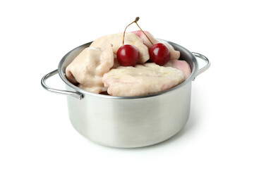 Pot with pierogi with cherry isolated on white background