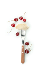 Fork with pierogi with cherry isolated on white background