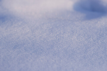 Snow surface with shadows and selective focus. 