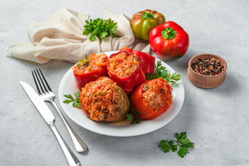 Stewed bell pepper stuffed with turkey meat, rice and vegetables. Healthy food. Side view, close-up.