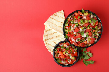 Mexican food concept with Pico de Gallo on red background