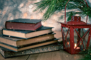christmas view with old books and lantern for christmas card