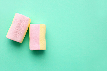 Tasty marshmallows on color background