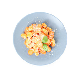Delicious gnocchi with tomato sauce in plate on white background