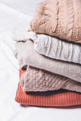 Fototapeta na wymiar warm pile sweaters, the concept of winter clothing 
