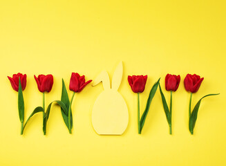 Tulips red on a yellow background. Greeting card, invitations, big discounts, sales for the holidays.
