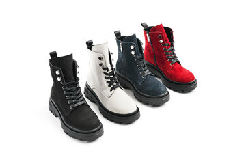 autumn fashion shoes red black white blue on a white background. filming a lookbook and a catalog for shoes. leather shoes for autumn