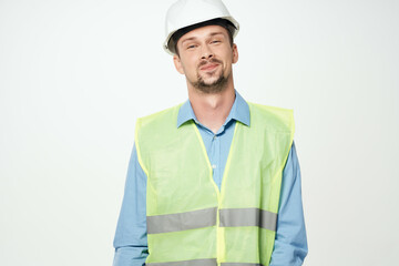 man reflective vest blueprints builder light background