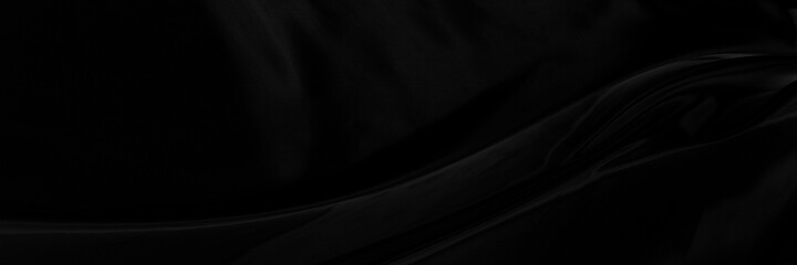 Black gray satin dark fabric texture luxurious shiny that is abstract silk cloth panorama background with patterns soft waves blur beautiful.