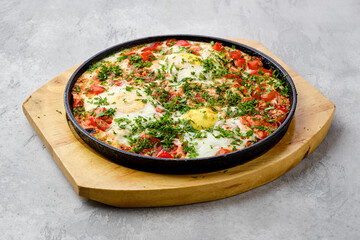 Eggs with tomato baked in oven