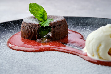 Closeup view of classic chocolate fondant with ice cream