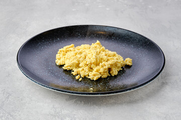 Classic scrambled eggs on a plate.