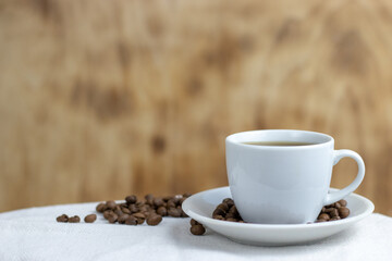 Coffee with milk in a white cup.