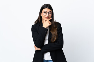 Business woman over isolated white background thinking an idea