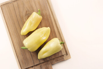 sweet yellow pepper on a wooden board