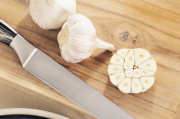 still life photo with garlic - whole garlic and cut in half