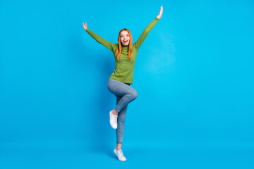 Full length body size view of attractive cheerful girlish funny girl jumping fooling isolated over bright blue color background