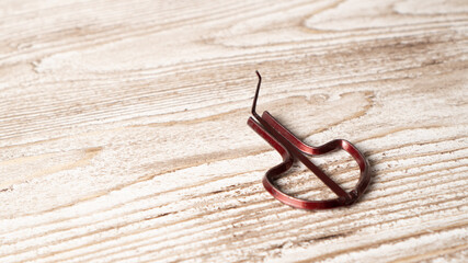 Musical instrument drymba. Traditional vargan. Small ethnic instrument. Folk drymba on wooden background