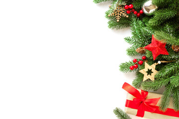 Christmas frame with decorations, viburnum berries, wooden snowflakes, fir tree branches and confetti. Merry Christmas white background ,New Year concept for design template or mockup with copy space.