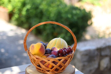 Vintage basket filled with various fruit. Selective focus.