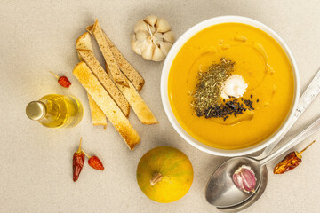 Pumpkin cream soup. Traditional autumn food. Hot dish, ripe vegetables, fragrant spices