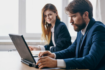 Fototapeta na wymiar business man and woman sitting in front of a laptop teamwork internet officials