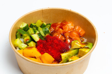 Poke bowl with raw salmon, rice and vegetables on white background