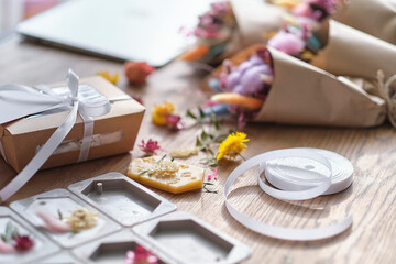 dried flowers, aromatic sachets made by hand. Autumn composition on a wooden table. Gift Box with,...