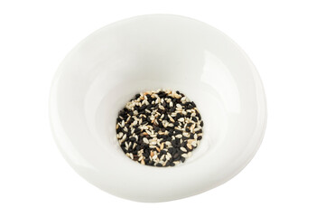 Black and white sesame seeds in a white plate. Healthy products. Close-up. Isolated on white background.